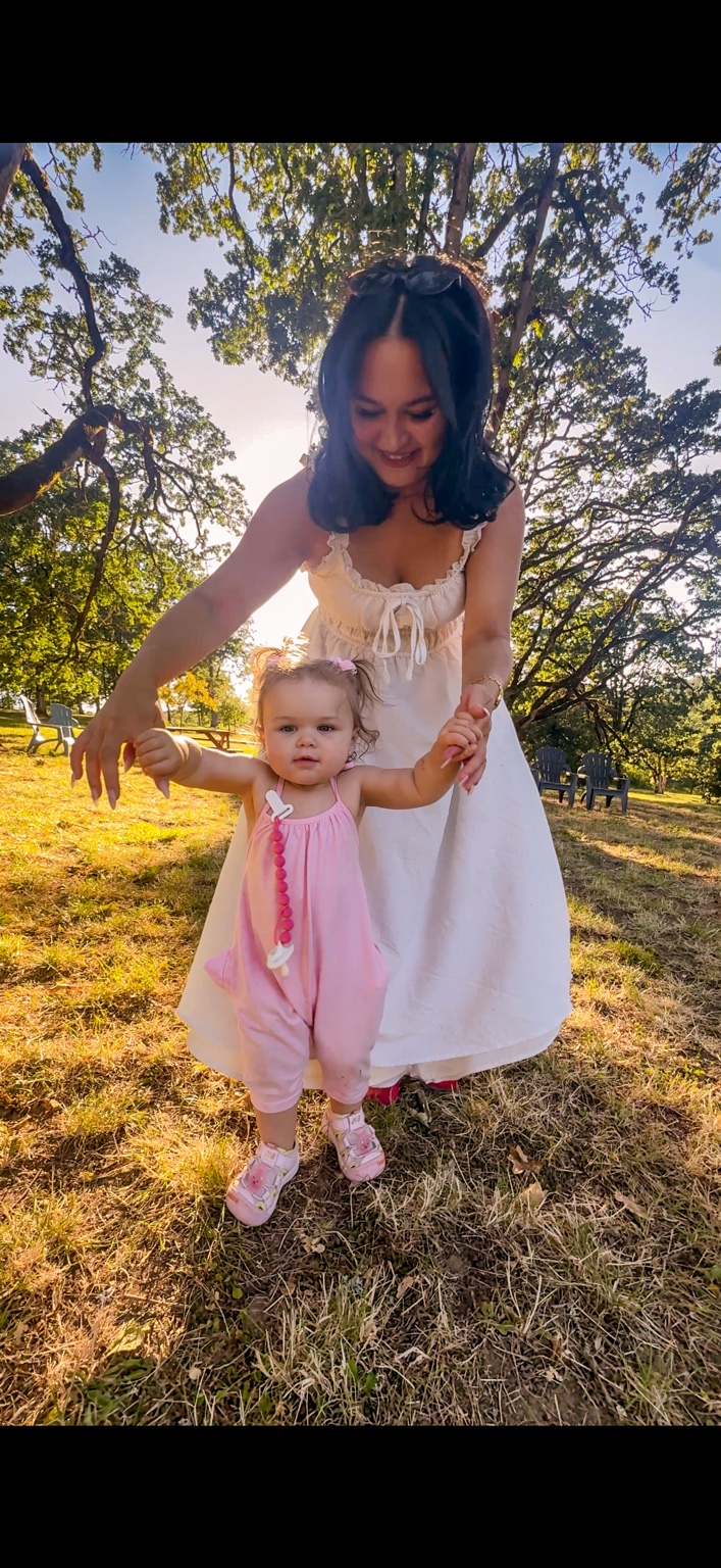 Kameesha helping Richie take her first steps